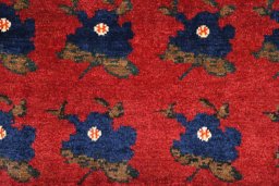 Surface texture of 2000s Persian Gabbeh rug with natural Wool and intricate pattern
