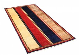 Corner detail of 2000s Persian Gabbeh rug showing border pattern and Wool pile