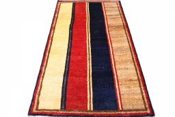 Surface texture of 2000s Persian Gabbeh rug with natural Wool and intricate pattern