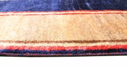 Close-up detail of 2000s Persian Gabbeh rug from Iran / Persia showing Wool weave