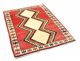 Corner detail of 2000s Persian Gabbeh rug showing border pattern and Wool pile