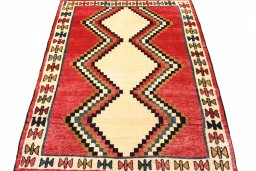 Surface texture of 2000s Persian Gabbeh rug with natural Wool and intricate pattern