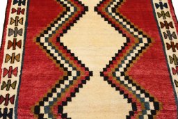 Backside of handmade 2000s Persian Gabbeh rug showing knot structure and weave density