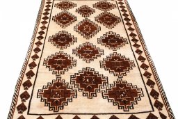 Surface texture of 2000s Persian Gabbeh rug with natural Wool and intricate pattern