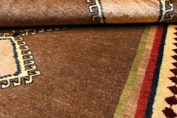 Corner detail of 1970s Persian Gabbeh rug showing border pattern and Wool pile