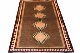Surface texture of 1970s Persian Gabbeh rug with natural Wool and intricate pattern