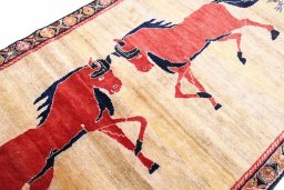 Corner detail of 1970s Persian Gabbeh rug showing border pattern and Wool pile