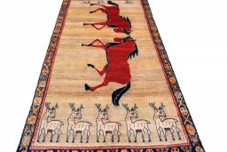 Surface texture of 1970s Persian Gabbeh rug with natural Wool and intricate pattern