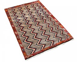 Corner detail of 2000s Persian Gabbeh rug showing border pattern and Wool pile