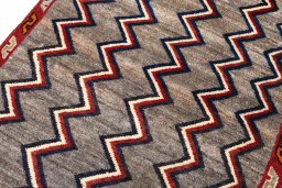 Backside of handmade 2000s Persian Gabbeh rug showing knot structure and weave density