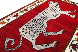 Corner detail of 2000s Persian Gabbeh rug showing border pattern and Wool pile