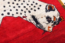 Surface texture of 2000s Persian Gabbeh rug with natural Wool and intricate pattern