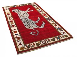 Corner detail of 2000s Persian Gabbeh rug showing border pattern and Wool pile