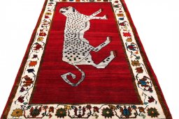 Surface texture of 2000s Persian Gabbeh rug with natural Wool and intricate pattern
