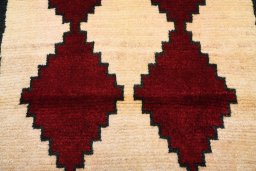 Backside of handmade 2000s Persian Gabbeh rug showing knot structure and weave density