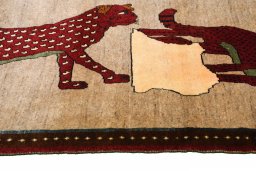Corner detail of 2000s Persian Gabbeh rug showing border pattern and Wool pile