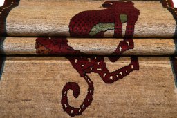 Surface texture of 2000s Persian Gabbeh rug with natural Wool and intricate pattern