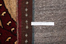 Backside of handmade 2000s Persian Gabbeh rug showing knot structure and weave density