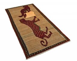 Corner detail of 2000s Persian Gabbeh rug showing border pattern and Wool pile
