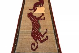 Surface texture of 2000s Persian Gabbeh rug with natural Wool and intricate pattern