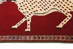 Corner detail of 2000s Persian Gabbeh rug showing border pattern and Wool pile