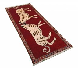 Corner detail of 2000s Persian Gabbeh rug showing border pattern and Wool pile