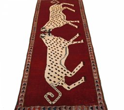 Surface texture of 2000s Persian Gabbeh rug with natural Wool and intricate pattern