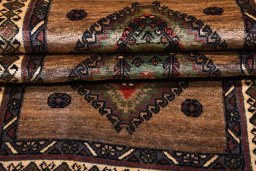 Corner detail of 2000s Persian Gabbeh rug showing border pattern and Wool pile