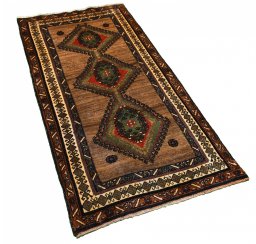 Corner detail of 2000s Persian Gabbeh rug showing border pattern and Wool pile