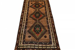 Surface texture of 2000s Persian Gabbeh rug with natural Wool and intricate pattern