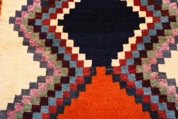 Backside of handmade 2000s Persian Gabbeh rug showing knot structure and weave density