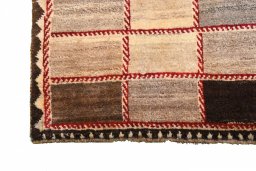 Full view of 2000s Persian Gabbeh rug from Iran / Persia, 195 × 120 cm in Beige tones