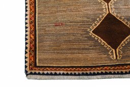 Corner detail of 2000s Persian Gabbeh rug showing border pattern and Wool pile