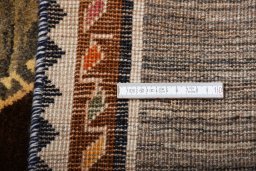 Surface texture of 2000s Persian Gabbeh rug with natural Wool and intricate pattern