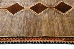 Close-up detail of 2000s Persian Gabbeh rug from Iran / Persia showing Wool weave