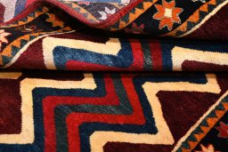 Corner detail of 2000s Persian Gabbeh rug showing border pattern and Wool pile