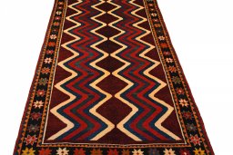 Surface texture of 2000s Persian Gabbeh rug with natural Wool and intricate pattern