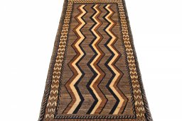 Surface texture of 2000s Persian Gabbeh rug with natural Wool and intricate pattern
