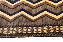 Close-up detail of 2000s Persian Gabbeh rug from Iran / Persia showing Wool weave