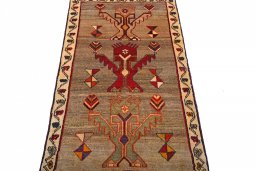 Surface texture of 2000s Persian Gabbeh rug with natural Wool and intricate pattern