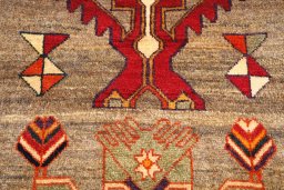 Backside of handmade 2000s Persian Gabbeh rug showing knot structure and weave density