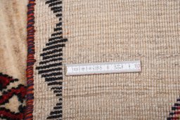 Surface texture of 2000s Persian Gabbeh rug with natural Wool and intricate pattern