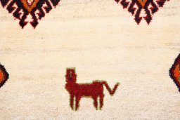 Backside of handmade 2000s Persian Gabbeh rug showing knot structure and weave density