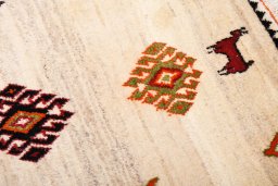 Close-up detail of 2000s Persian Gabbeh rug from Iran / Persia showing Wool weave