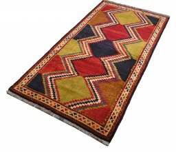 Close-up detail of 2000s Persian Gabbeh rug from Iran / Persia showing Wool weave