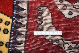 Surface texture of 2000s Persian Gabbeh rug with natural Wool and intricate pattern