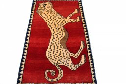 Surface texture of 2000s Persian Gabbeh rug with natural Wool and intricate pattern