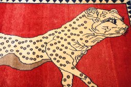 Backside of handmade 2000s Persian Gabbeh rug showing knot structure and weave density