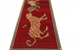 Surface texture of 2000s Persian Gabbeh rug with natural Wool and intricate pattern