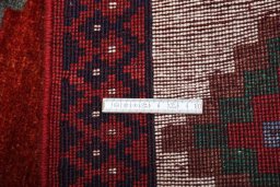 Corner detail of 2000s Persian Gabbeh rug showing border pattern and Wool pile
